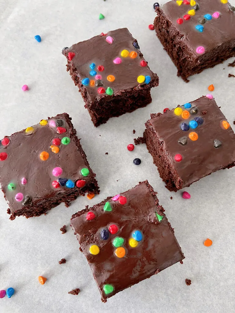 Homemade cosmic brownies on parchment paper.