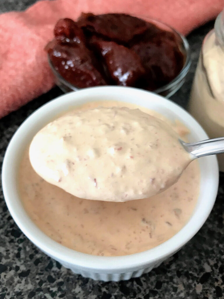 A spoonful of taco bell chipotle sauce.