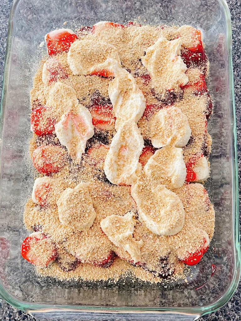 Strawberry dump cake in a baking dish.