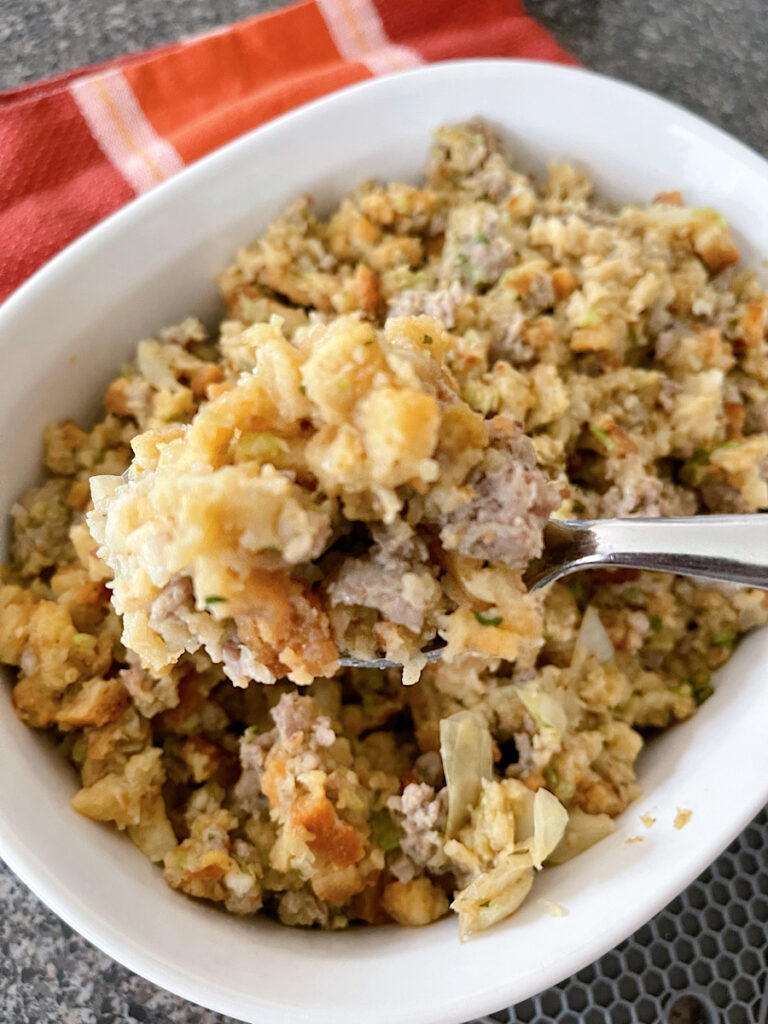 Thanksgiving Stove Top Stuffing with sausage in a white baking dish.