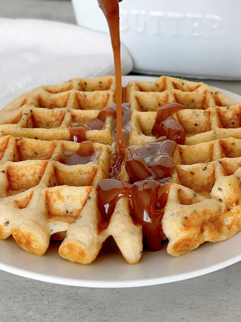 A Kodiak Protein Waffle drizzled with peanut butter syrup.
