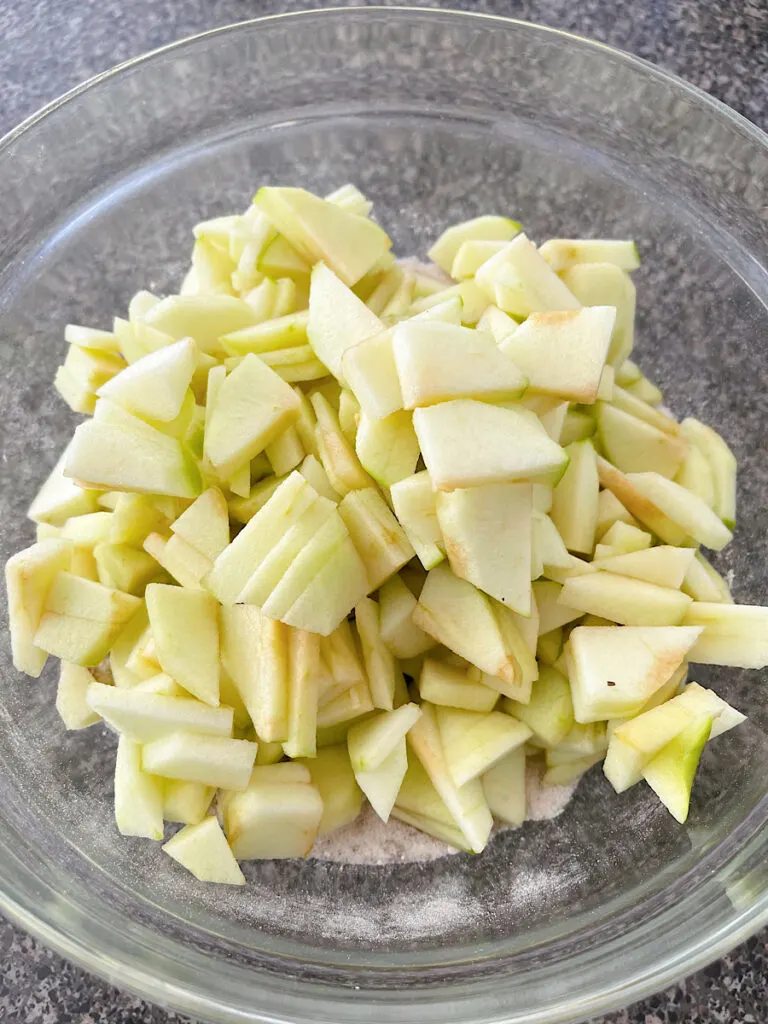 Sliced apples in a glass bowl.