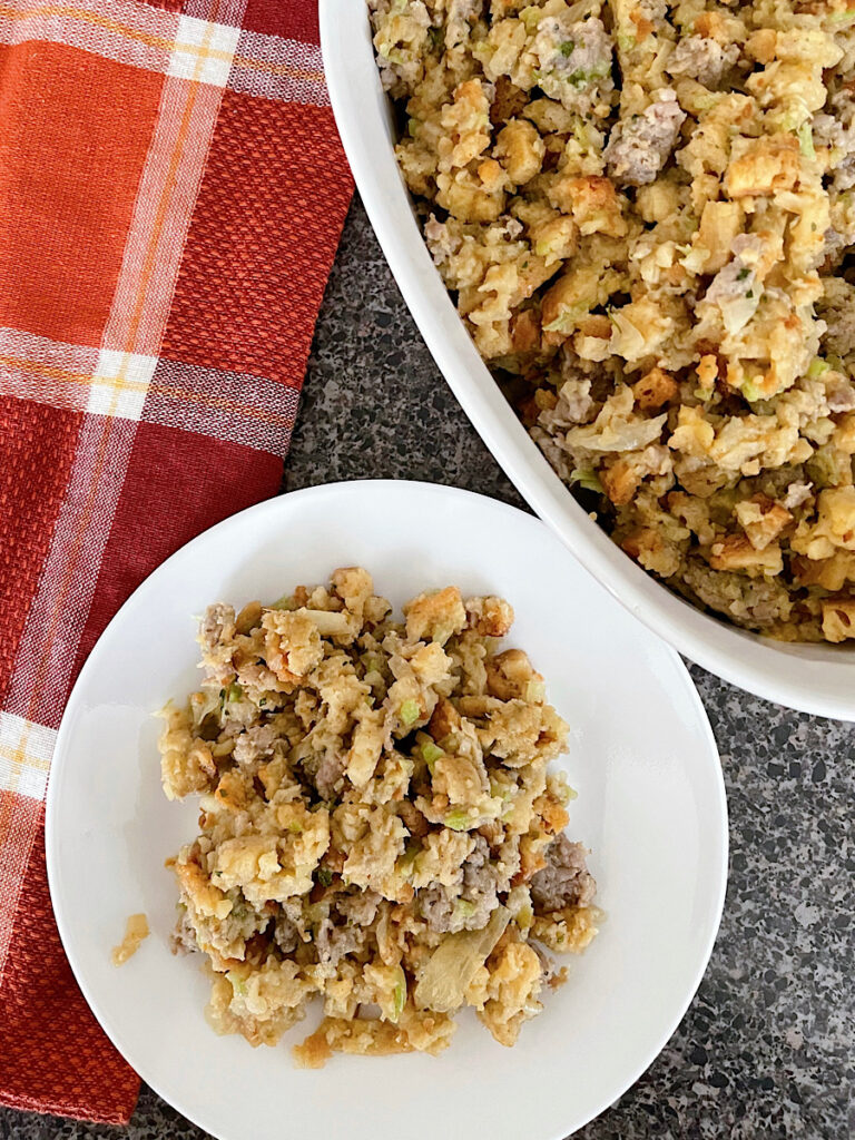 Thanksgiving Stove Top Stuffing with sausage in a white baking dish.