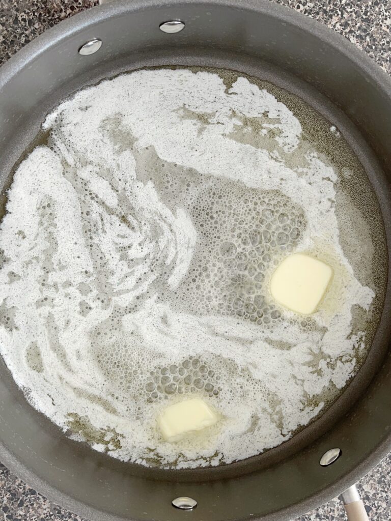 Butter melted in a saucepan.