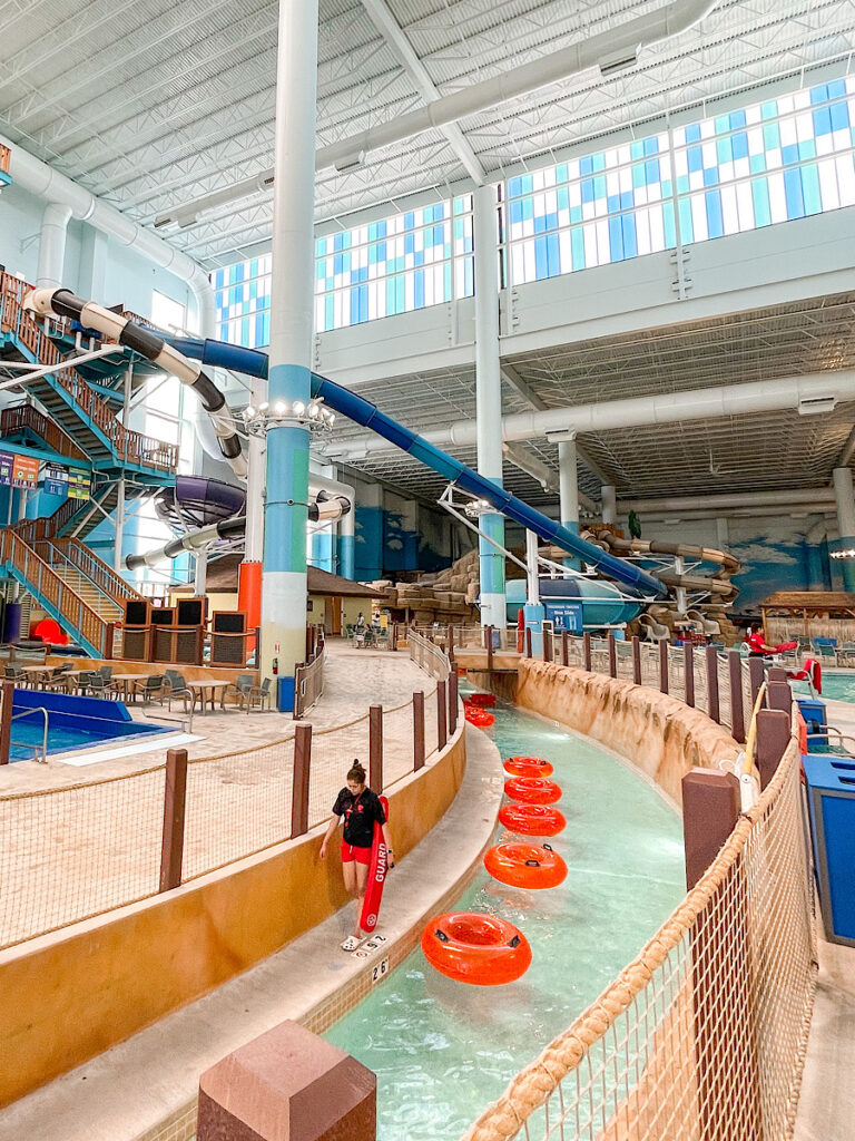 A lazy river with orange tubes inside Kalahari Texas indoor water park.