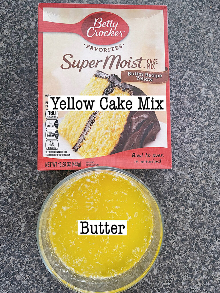 A yellow cake mix and a bowl of melted butter to make the topping of a pumpkin cobbler.