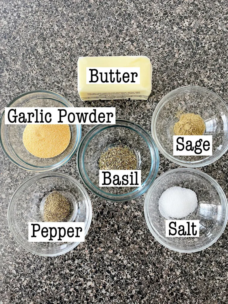 Ingredients to make a garlic herb butter rub for turkey.