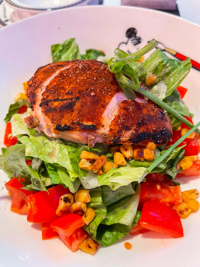 Blackened Chicken Salad- with oven roasted corn, romaine leaves, green onions, tomatoes, and a cilantro-lime dressing.
