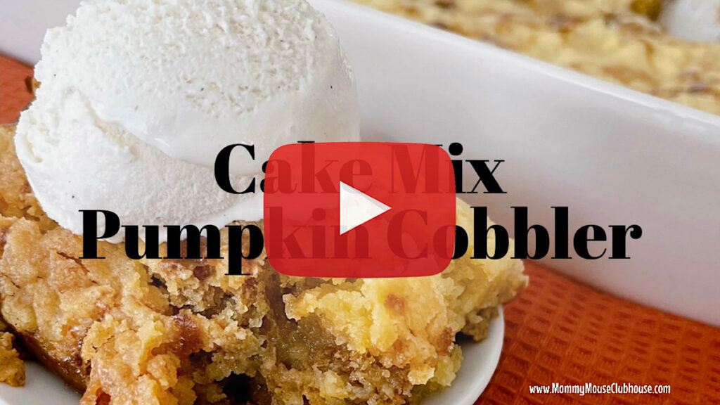 A slice of pumpkin cobbler with a scoop of vanilla ice cream.