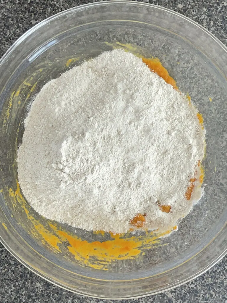 A spice cake mix mixed with pumpkin to make cookies.