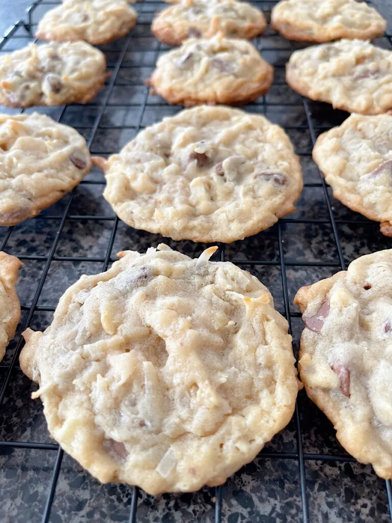 Almond joy cookies on a cooling rack.