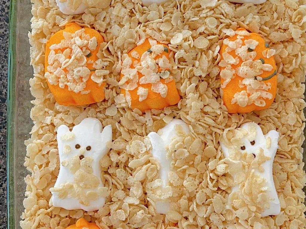 Halloween Peeps in a baking dish with Rice Krispies.