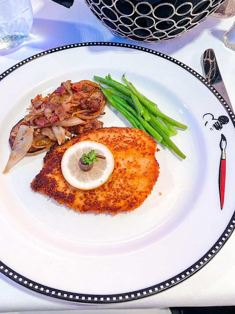 Chicken Schnitzel: Breaded Chicken Breast fried in Butter, served with Roasted Bacon Potatoes, and Buttered Green Beans from Animator's Palate on the Disney Magic.