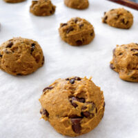 Spice Cake Mix Pumpkin Chocolate Chip Cookies on a baking sheet.