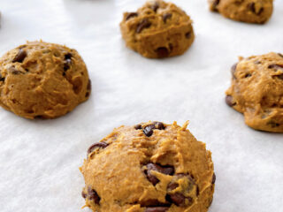 Spice Cake Mix Pumpkin Chocolate Chip Cookies on a baking sheet.