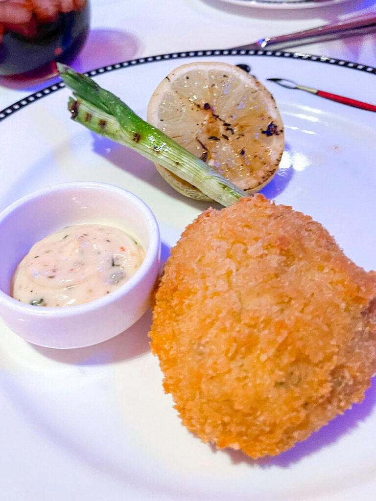 The Deep Fried Calypso Crab Cake: With Cajun Remoulade, Green Onion and Lemon on Pirate Night on the Disney Magic.