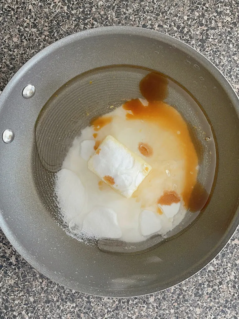 Butter, sugar, vanilla, and corn syrup in a sauce pan.