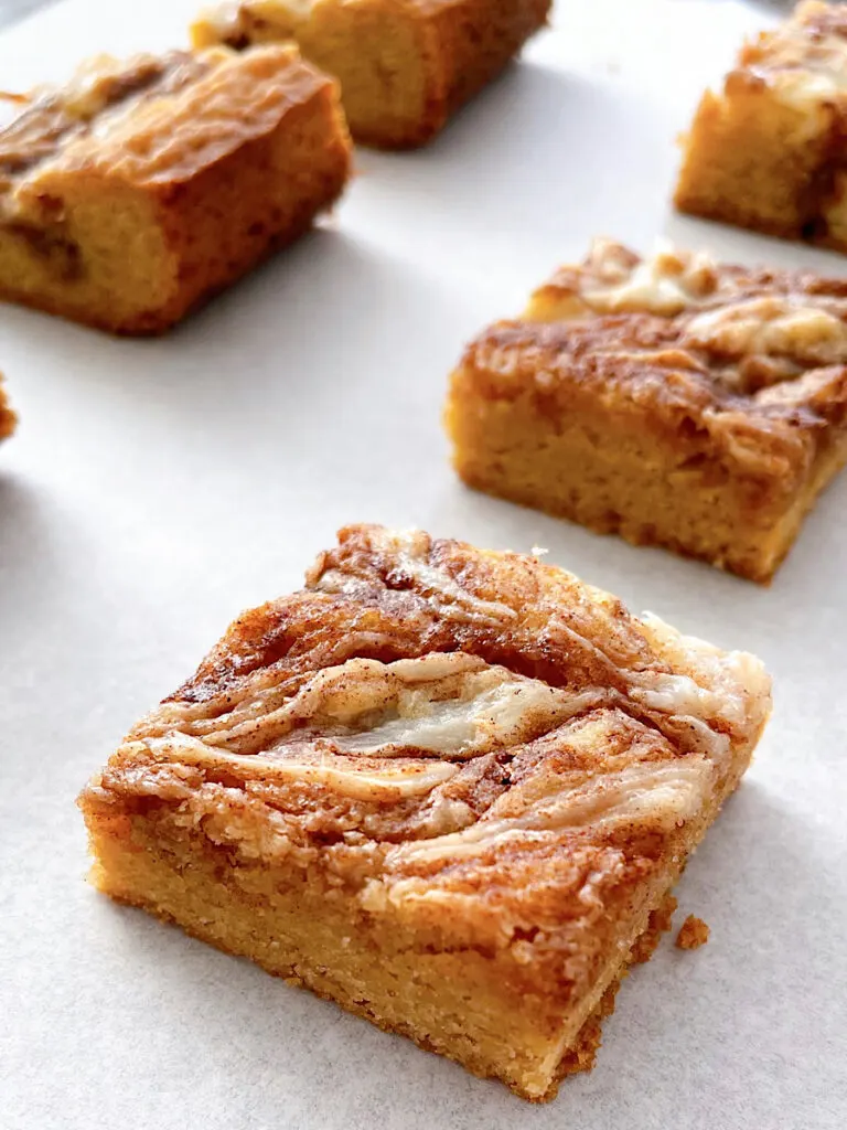 Cinnamon Roll Blondies cut into squares.