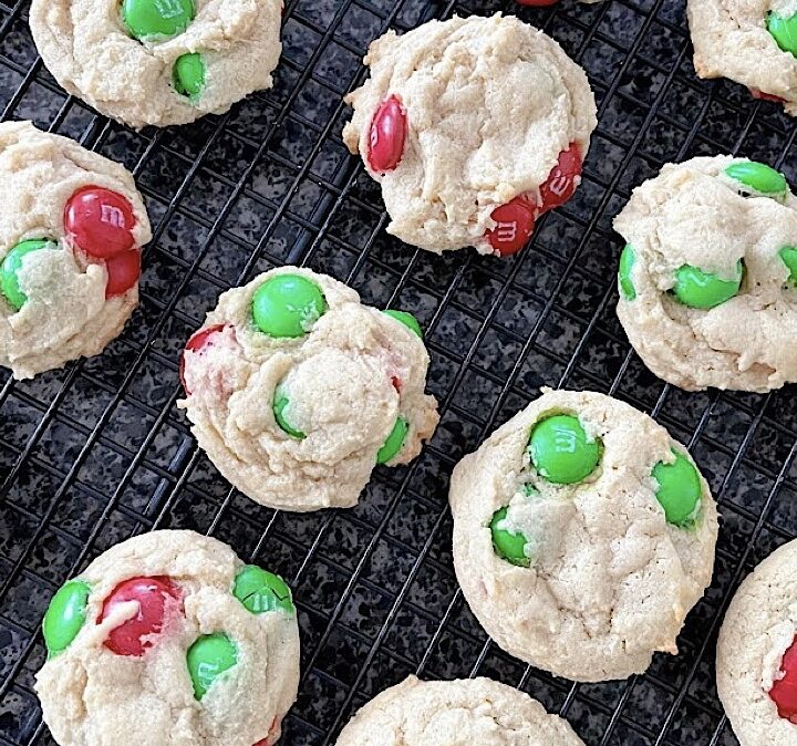 Cream cheese M&M cookies on a cooling rack.