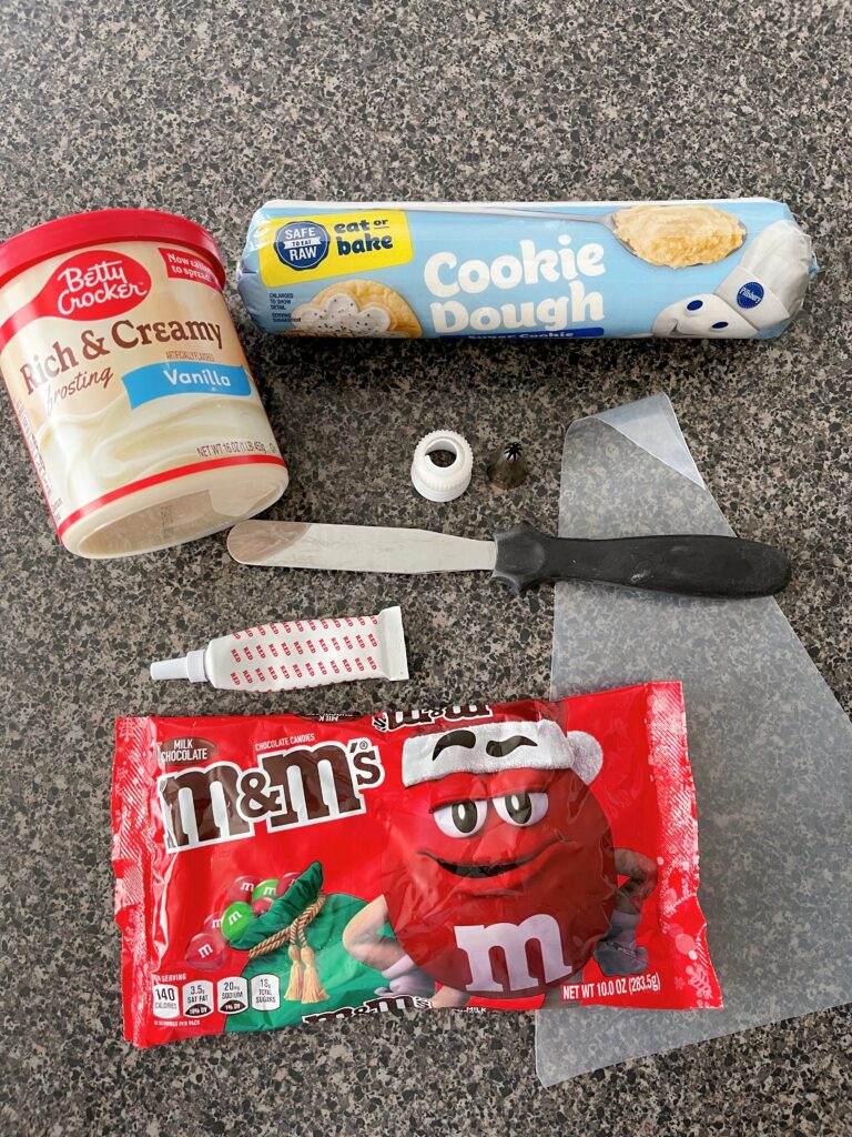 Items needed to make Santa Sugar Cookies.