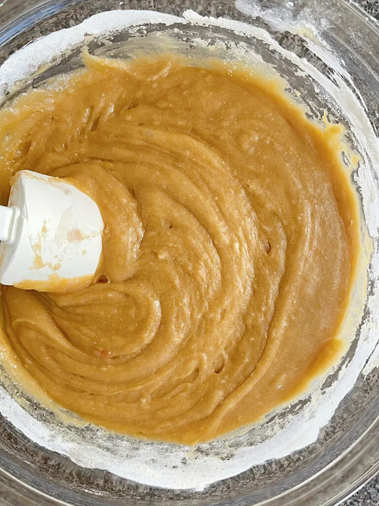 Blondie batter in a bowl with a spatula.