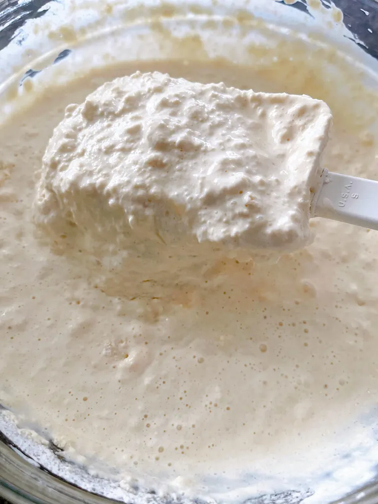 Thick sweet cream pancake batter in a mixing bowl.