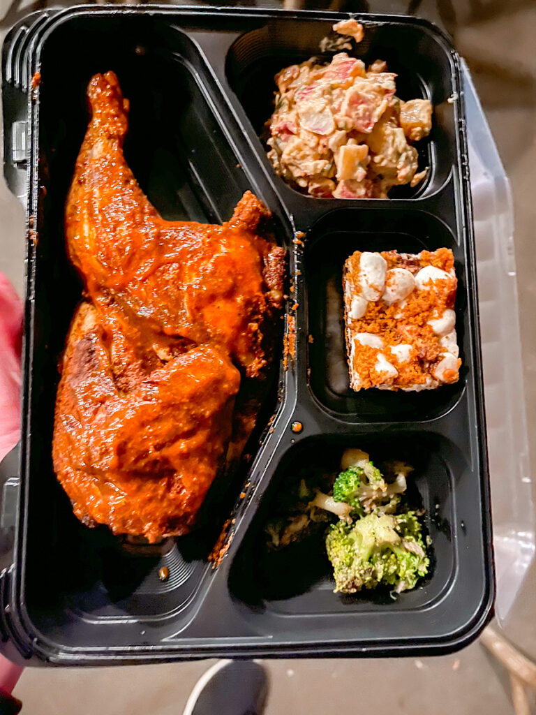 BBQ Half chicken from Hungry Bear Restaurant Fantasmic Dining Package with a side of Bacon Potato Salad, Broccoli, and a S'more's dessert.