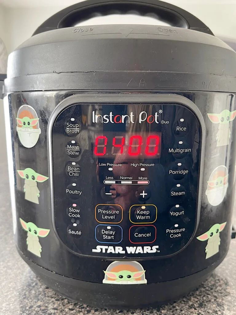 An instant pot set to slow cook for 4 hours.
