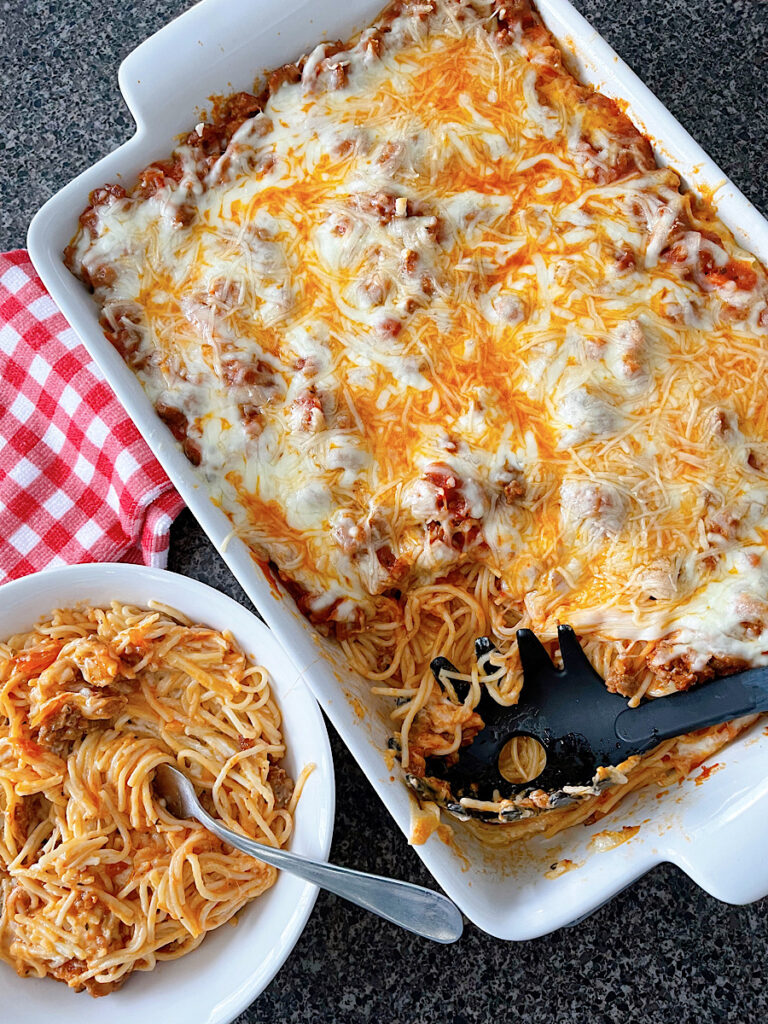 A pan and a bowl of TikTok Spaghetti Alfredo.