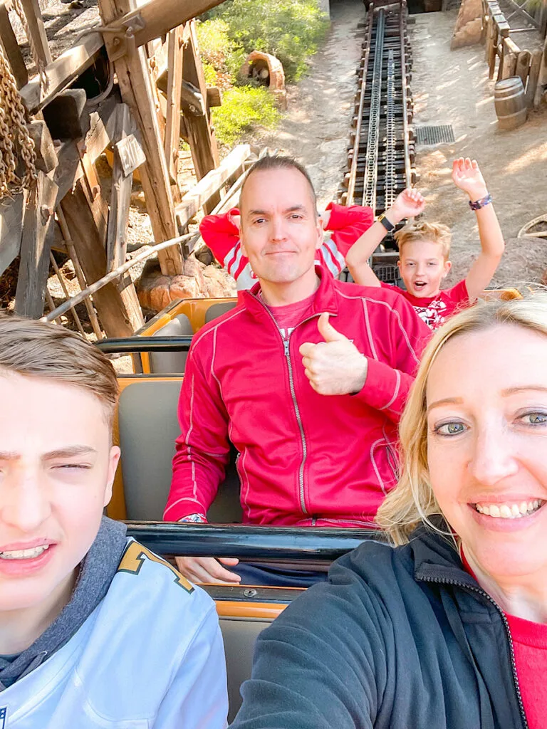 A family riding Big Thunder Mountain at Disneyland.