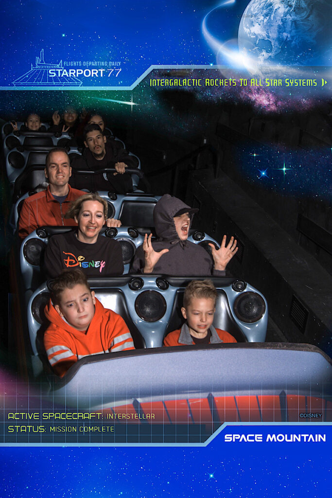A family riding Space Mountain at Disneyland.