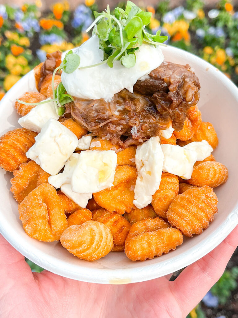 Gnocchi Poutine with Red Wine-Braised Beef, Cheese Curds, Basil and Burrata from Epcot Festival of the Arts.