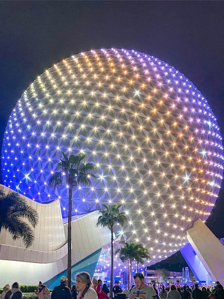 Spaceship Earth lit up at Epcot at Walt Disney World.