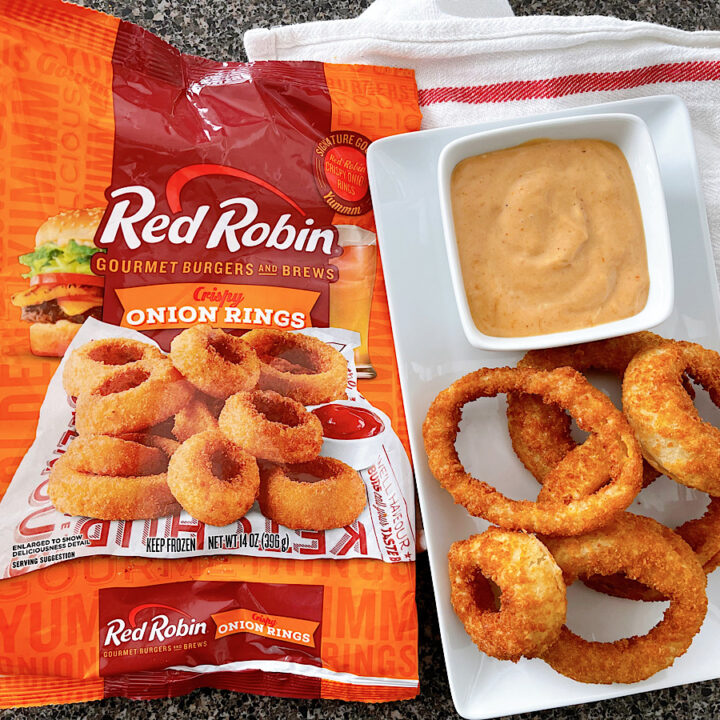 A bag of frozen Red Robin onion rings cooked in an air fryer and campfire sauce.