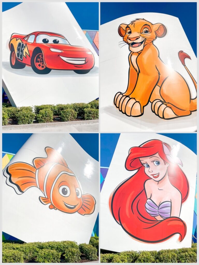 Entrance to Disney's Art of Animation Resort featuring giant paintings of Simba, Lightning McQueen, Ariel, and Nemo.