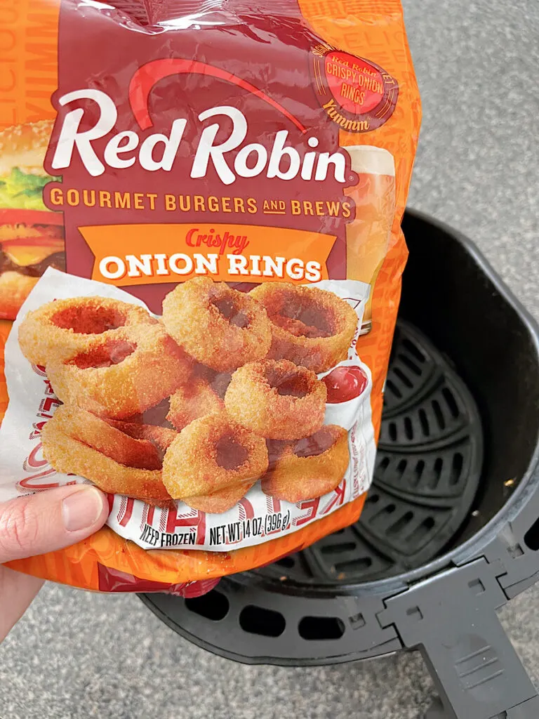 A bag of frozen Red Robin onion rings cooked in an air fryer and campfire sauce.