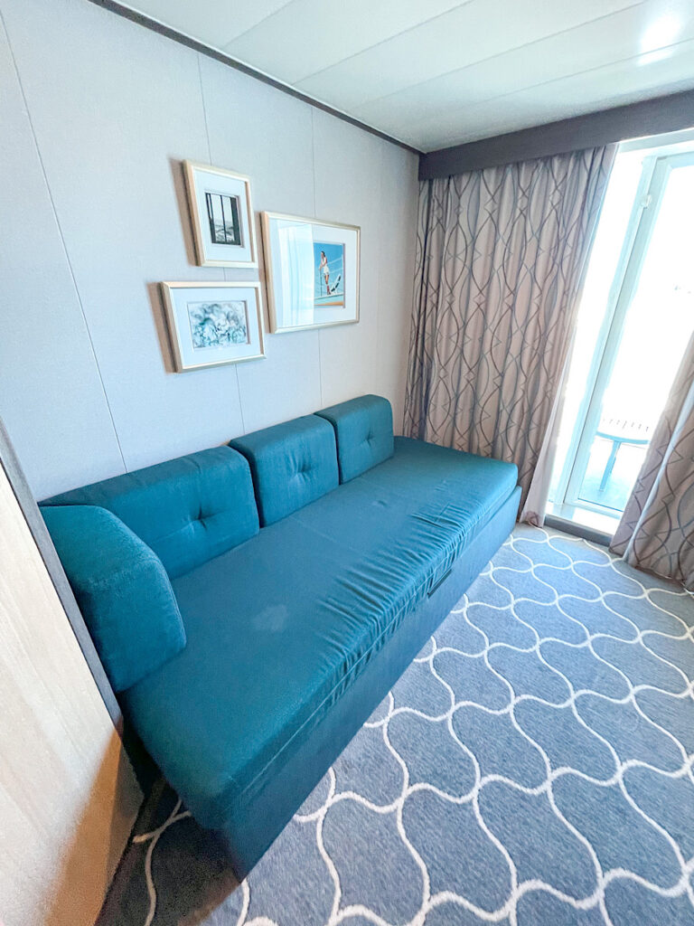 Couch that turns into a bed in Harmony of the Seas Stateroom 7666.