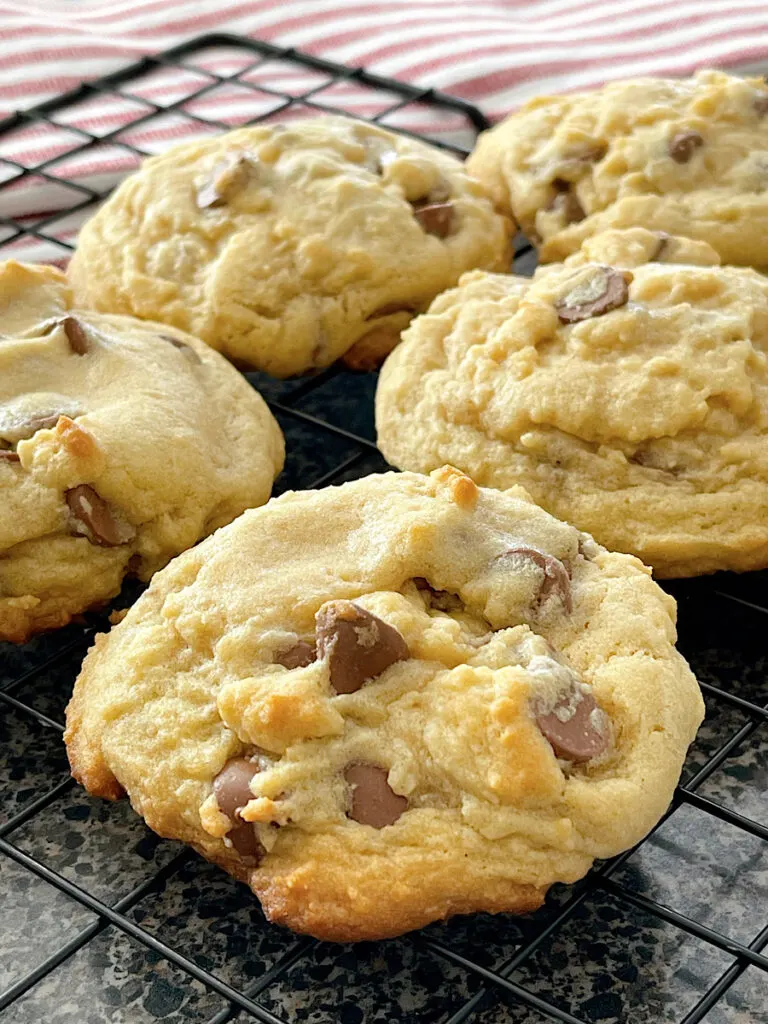 Copycat Crumbl Chocolate Chip Cookies on a cooling rack.