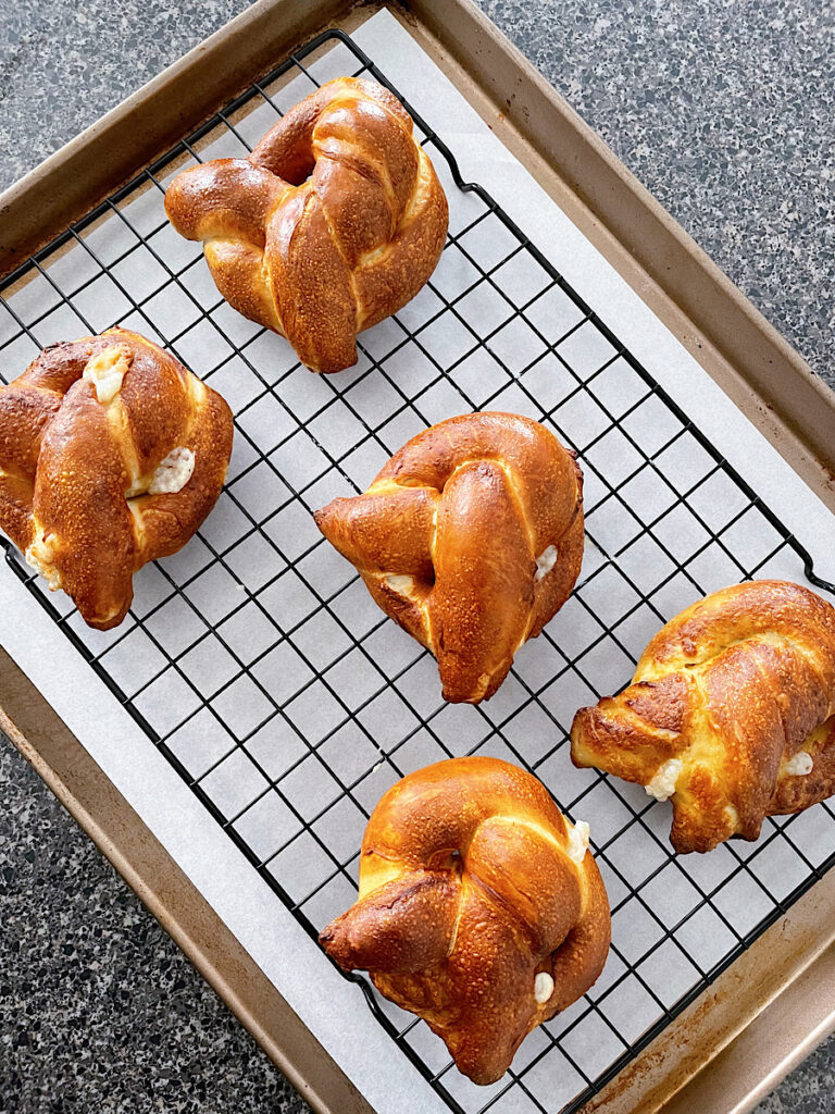 Soft pretzels made in an air fryer on a wire rack.