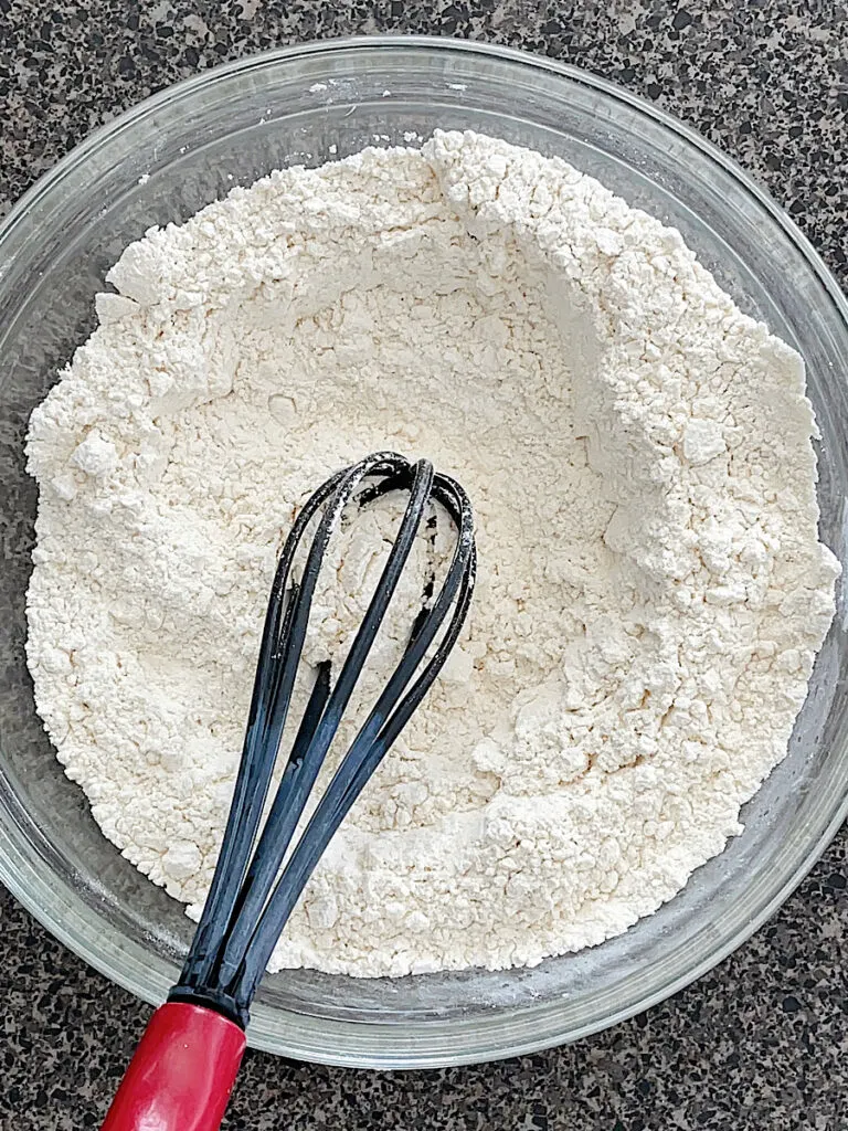 A bowl of dry ingredients for Crumbl cookies.