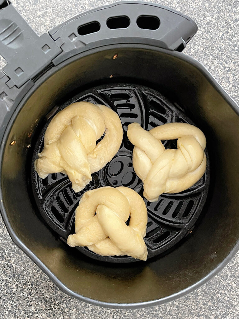 Pretzels about to be cooked in an air fryer.