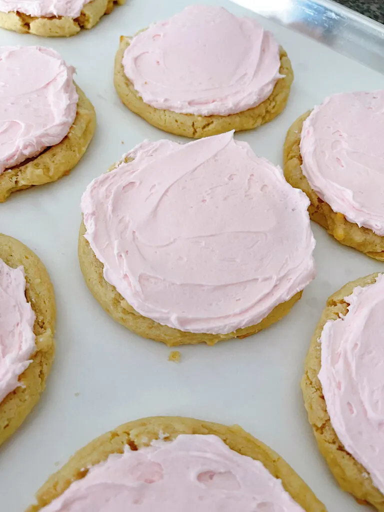 Copycat Crumbl sugar cookies on a baking sheet.