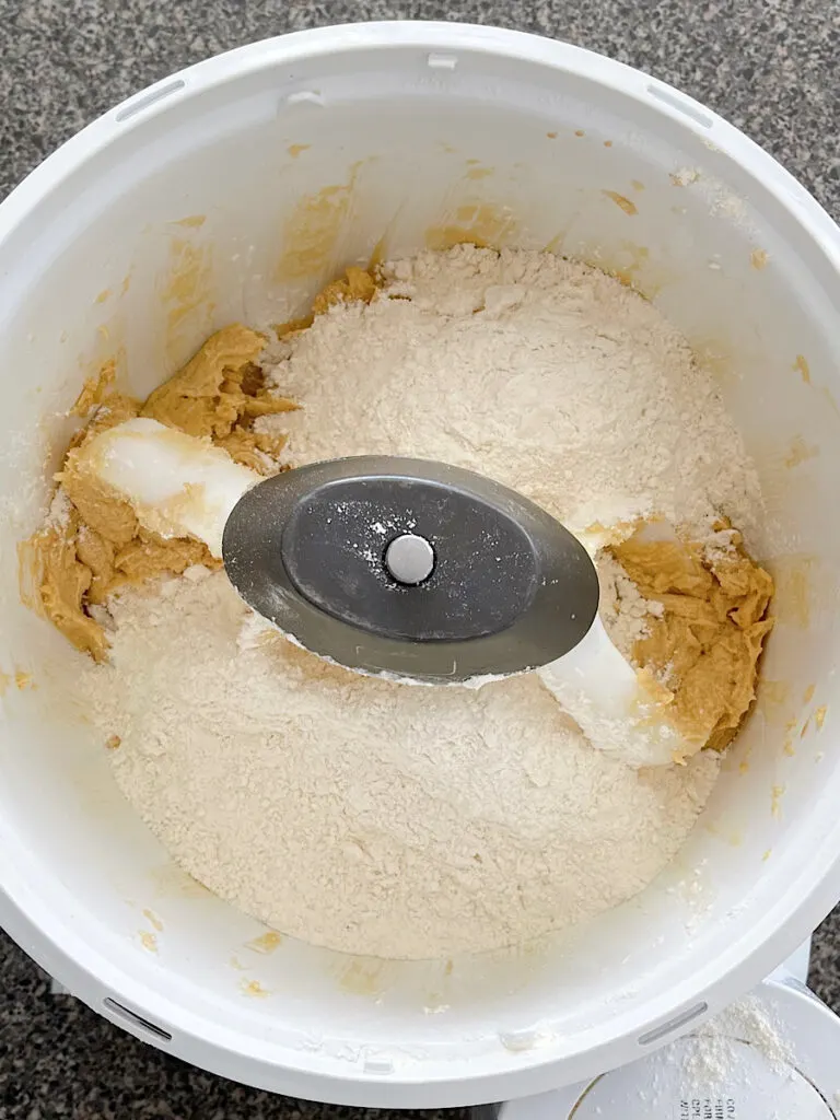 Wet and Dry ingredients for chocolate chip cookies in a stand mixer.