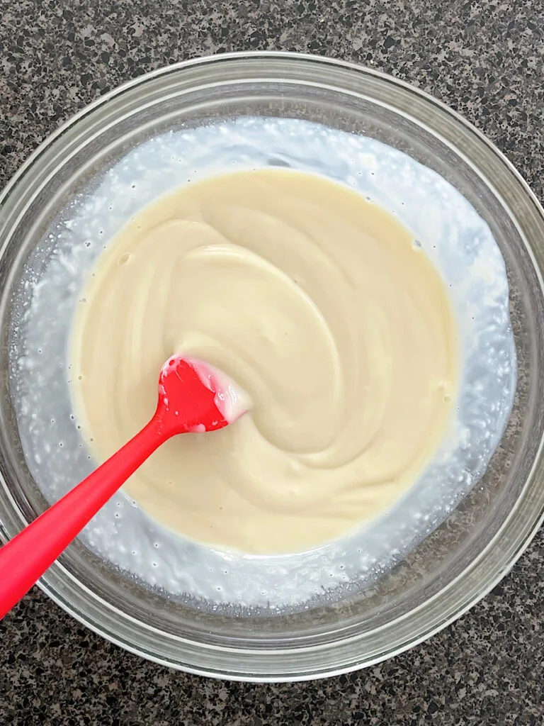 Lime juice and sweetened condensed milk in a mixing bowl.