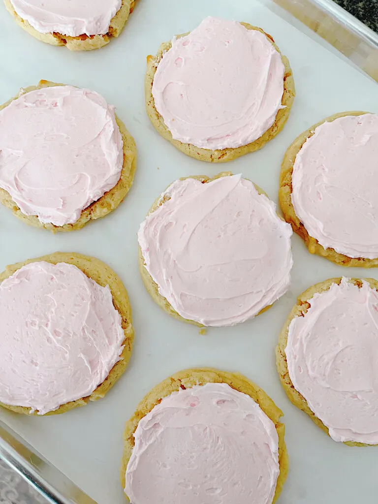 Copycat Crumbl sugar cookies on a baking sheet.