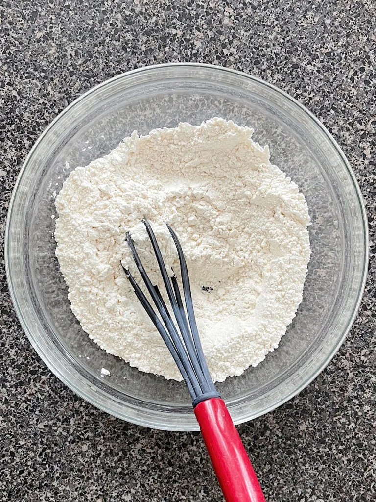 A bowl of dry ingredients to make sugar cookies.