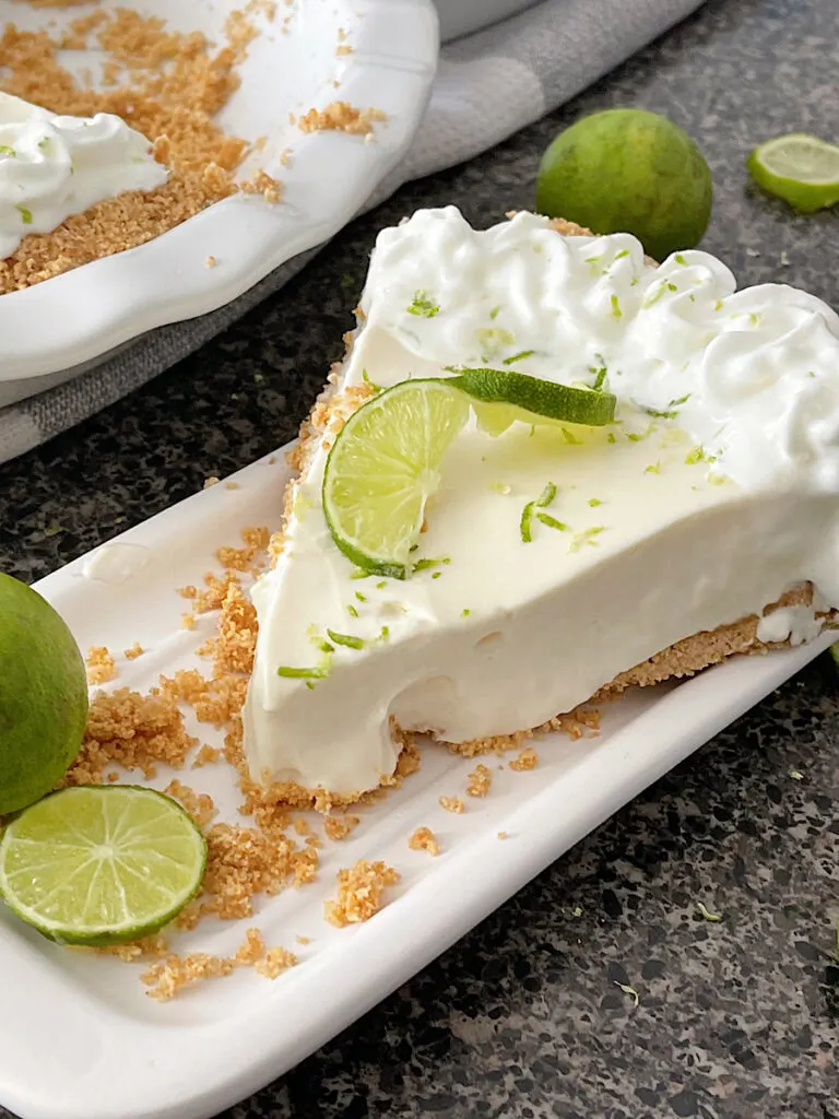 A slice of no bake Key Lime Pie made with Eagle Brand sweetened condensed milk.