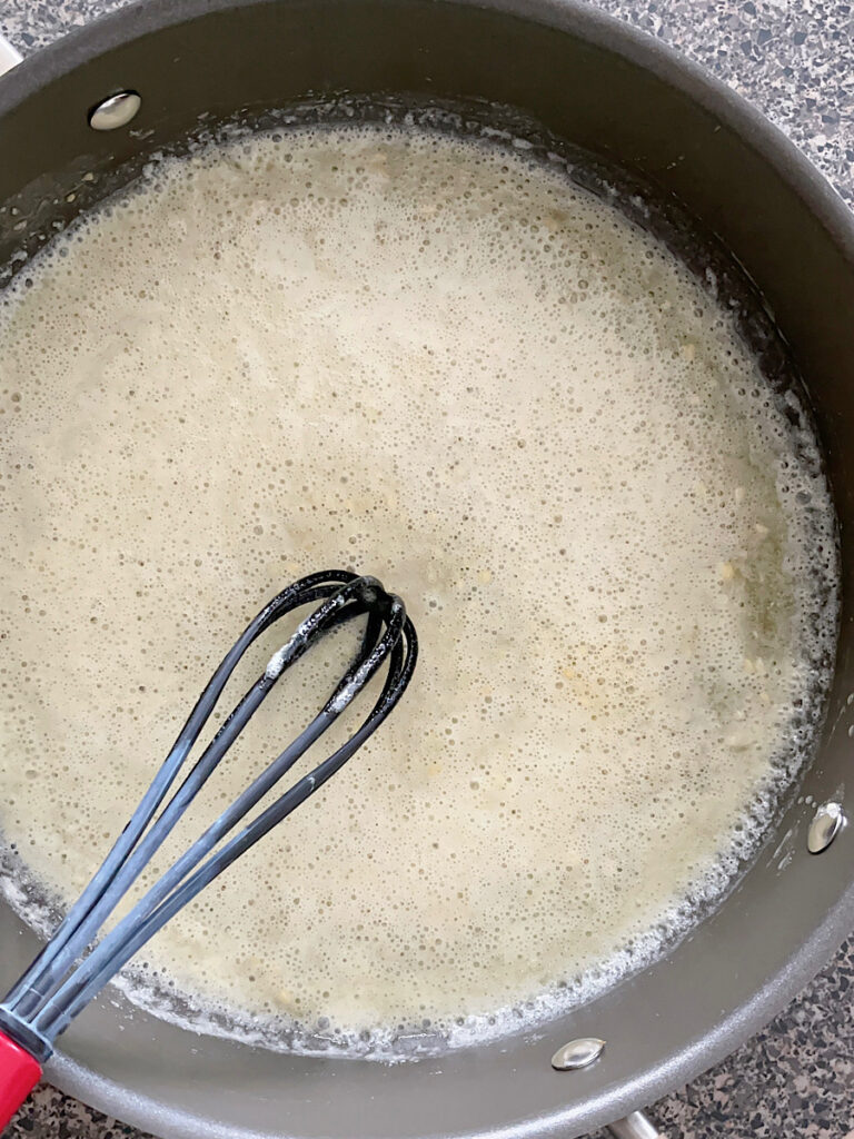 Butter, garlic, and flour in a sauce pan to make a roux.
