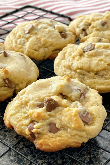 Copycat Crumbl Chocolate Chip Cookies on a cooling rack.