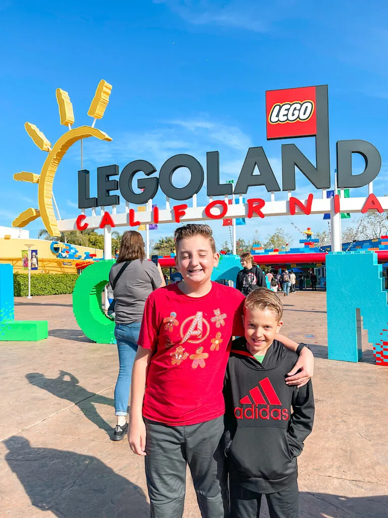Two kids in front of Legoland California.